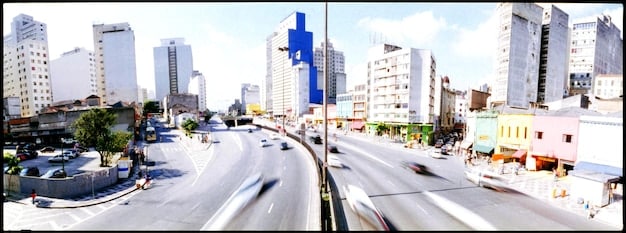 A split-screen image showing two contrasting scenarios: on one side, a bustling city center with people going to work (representing job growth), and on the other side, a closed business with a 