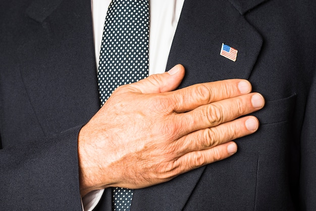 A close-up photo of President Biden signing an executive order, symbolizing the administration's direct action to combat inflation. The focus is on the pen and the official document.