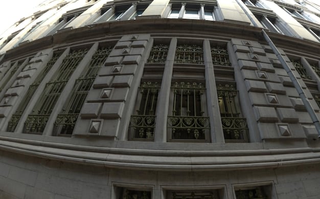 A photo of the Federal Reserve building, symbolizing its role in monetary policy. The building should look imposing and authoritative.