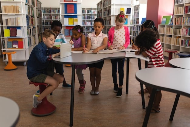 A group of elementary school students in a diverse classroom setting, actively participating in a lesson. The teacher is interacting with students individually, and the atmosphere is positive and engaging.