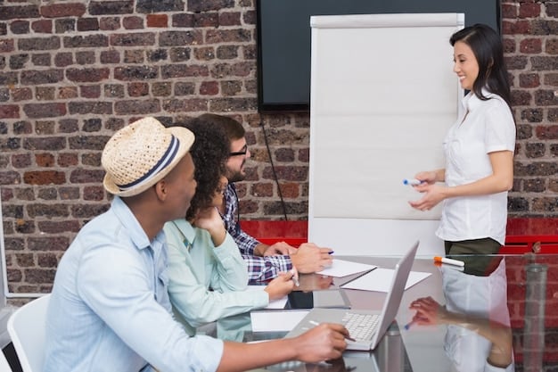 A group of trainees participating in a hands-on workshop, learning new skills with instructors guiding them. The setting is a modern training facility, emphasizing practical learning and skill development.