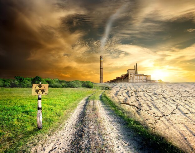 A split image showing a coal mine on one side and a solar panel field on the other, visually representing the contrast between fossil fuels and renewable energy.