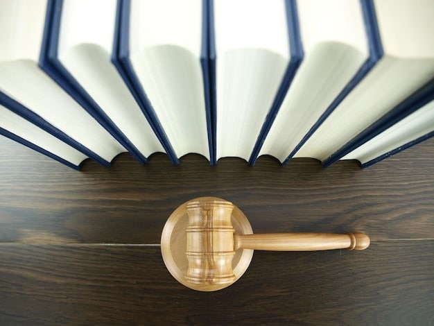 A gavel resting on a stack of textbooks in a government building setting.
